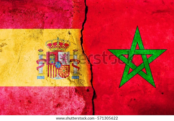A\
large crack in the wall. Flag of Spain. Flag of\
Morocco