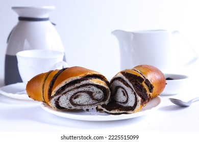 Large cross-sectional croissant with chocolate striped filling. Shallow depth of field