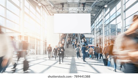 Large Crowd Of Anonymous Blurred People At A Trade Show