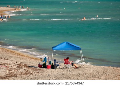 Large Crowd Of People On Sandy Ocean Beach Sunbathing And Enjoyng Vacation By The Sea. Venice, USA - June 14, 2022.