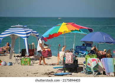 Large Crowd Of People On Sandy Ocean Beach Sunbathing And Enjoyng Vacation By The Sea. Venice, USA - June 14, 2022.