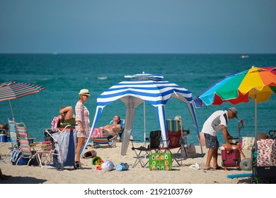 Large Crowd Of People On Sandy Ocean Beach Sunbathing And Enjoyng Vacation By The Sea. Venice, USA - June 14, 2022.