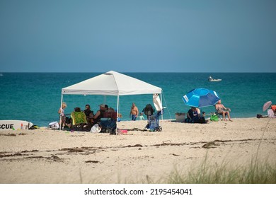 Large Crowd Of People On Sandy Ocean Beach Sunbathing And Enjoyng Vacation By The Sea. Venice, USA - June 14, 2022.