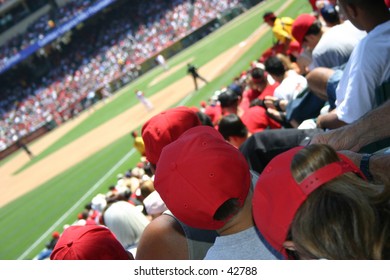 A Large Crowd Watching A Baseball Game.