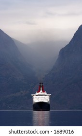Large cruise ship entering a Norwegian fjord - front view