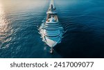 Large cruise ship sailing on the ocean with a beautiful sunset backdrop