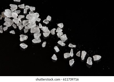 Large crystals of sea salt on a black background
