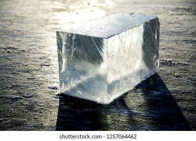 A Large Cube Of River Ice Under The Rays Of The Sun.