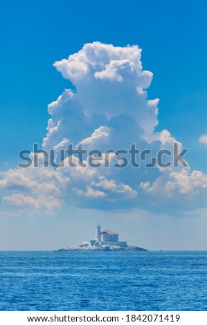 large cumulonimbus over the lighthouse, adriatic sea, Croatia