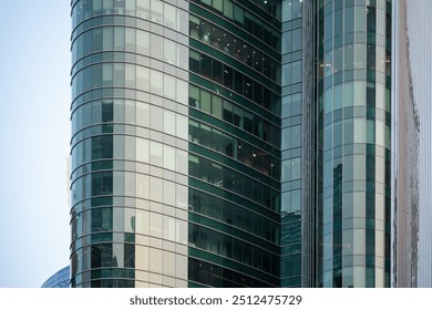 Large curved glass facade office building in Dubai, Modern Architectural design commercial tower - Powered by Shutterstock