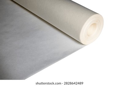 Large cylindrical roll of smooth translucent paper used in engineering