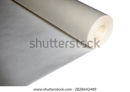 Large cylindrical roll of smooth translucent paper used in engineering