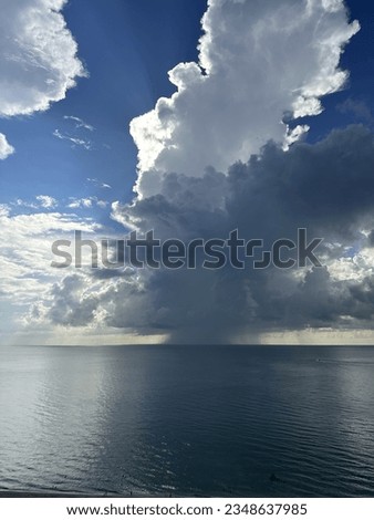 Large dark thunderstorm clouds over the Atlantic Ocean in Sunny Isles Beach, Florida