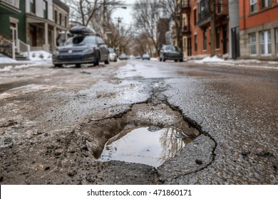 Large Deep Pothole In Montreal Street, Canada.