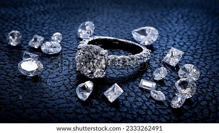 Large diamond ring surrounded by gems on black textured background 