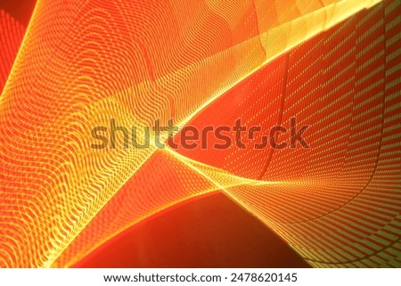A large display featuring a pattern of orange lights radiating outward along distinct lines