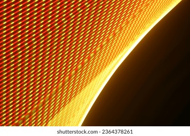 A large display featuring a pattern of red and yellow lights radiating outward along distinct lines