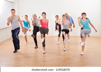 Large Diverse Group Of People Doing Aerobics Exercises In A Class In A Gym In A Health And Fitness Concept