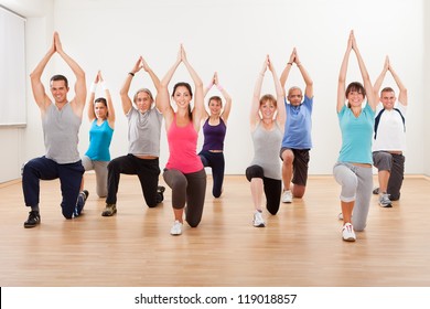 Large Diverse Group Of People Doing Aerobics Exercises In A Class In A Gym In A Health And Fitness Concept