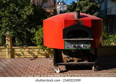 Large Domed Red Metal Outdoor Pizza Oven. 