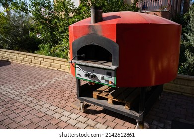 Large Domed Red Metal Outdoor Pizza Oven. 