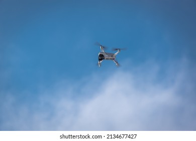 A Large Drone Flies In The Sky.