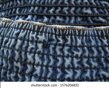 Large Elastic Waistband In Jeans. Denim Texture. Blue Jeans Background. Close-up. Copy Space.