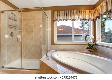 Large Elegant Master Bathroom With Shower, And Big Bath Tub.