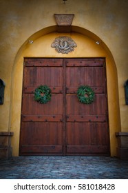 Large Elegant Wooden Entrance Doors To Cellar With Christmas Wreaths At California Central Coast Winery 