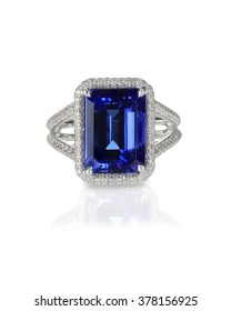 Large emerald cut sapphire engagement fashion ring with halo setting and pave diamonds