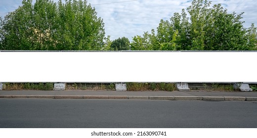 Large Empty White Advert Billboard Fixed On Concrete Fence On Sidewalk At City Street Front View