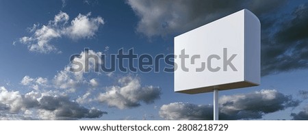 A large, empty white billboard stands tall against a backdrop of dynamic clouds and a blue sky, offering a clean canvas for any message.