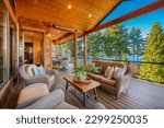 large expansive deck porch patio with furnishings front door dining table comfortable lounge chairs