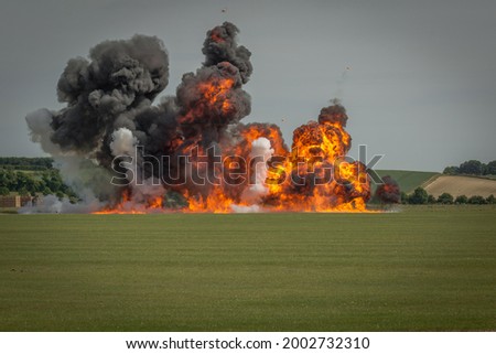 A large explosion during daylight in an open field