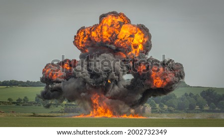 A large explosion during daylight in an open field