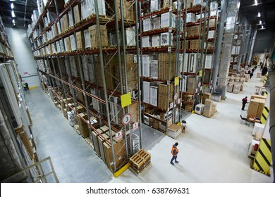 Large factory or warehouse with goods and workers