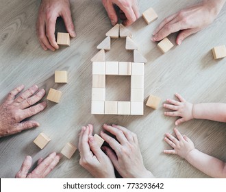 A Large Family Is Building A House. Concept For Loan And Construction