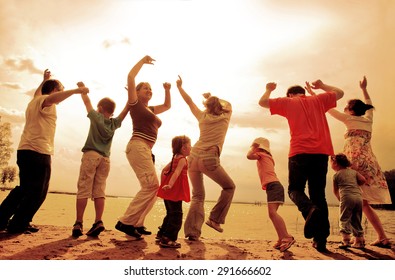 Large Family With Children Having Fun Together In The Nature