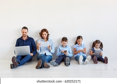 Large family with gadgets - Shutterstock ID 620252171