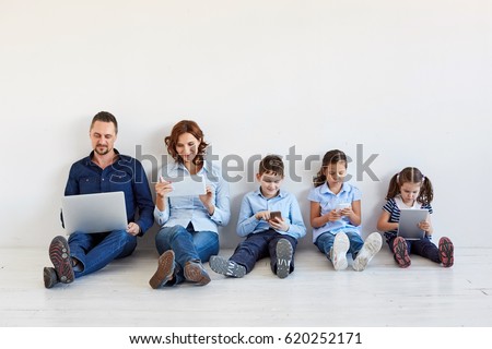Large family with gadgets