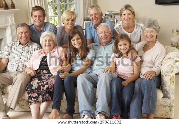 Large Family Group\
Sitting On Sofa Indoors