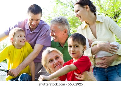 Large Family Plays In The Park