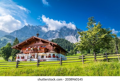 A large farm house in the mountains. Mountain house view. Farm house in mountains. Farm in mountainside