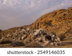 A large Felsic Pegmatite outcropping among the Aus mountains in the Sperrgebiet Rand park nature reserve, in Namibia in the late afternoon light.