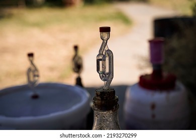 Large fermenting barrels with an oxygen supply cap. - Powered by Shutterstock