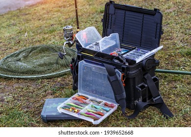 A large fisherman's tackle box fully stocked with lures and gear for fishing.fishing lures and accessories in the box background. - Powered by Shutterstock