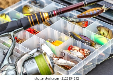 A large fisherman's tackle box fully stocked with lures and gear for fishing.fishing lures and accessories. fishing spinning. Kit of fishing lures. - Shutterstock ID 2128154852