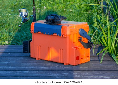 A large fisherman's tackle box fully stocked with lures and gear for fishing.fishing lures and accessories.Fishing tackle - fishing spinning.  - Powered by Shutterstock