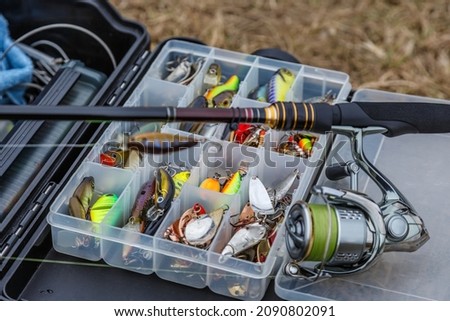 Box with lures lies on the fishing bag - Free Stock Photo by Ivan