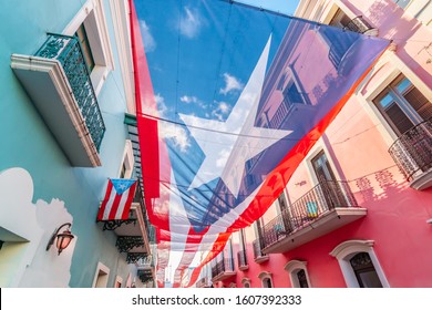 Large flag of Puerto Rico above the street in the city center of San Juan.